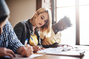 Poster - Youll never go wrong as long you study. Cropped shot of university students in class.