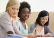 © Nicola Katie/peopleimages.com - Class is in session. Shot of female university students sitting in an exam room.