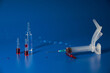 © diczman - Syringe and medicines lie on blue background