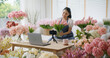 © ChayTee - Asia girl vlogger influencer or SME owner people smile work on home video camera selfie shoot filming for live sell show happy talk on mobile VoIP app. Remote sale product at modern florist gift shop.