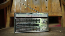 Old Radio On A Wooden Chair. Focus Selected