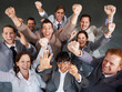 © M S/peopleimages.com - Another deal sealed. Top view of a group of young business executives celebrating together.