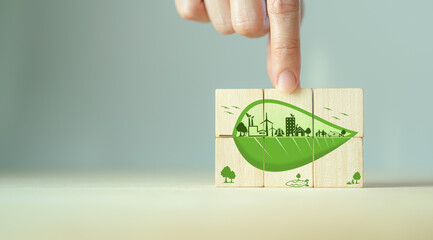 Wall Mural - Zero emisson, ecological and net zero concept.  Eco friendly symbols with green leaves on wooden cubes.  Sustainable development strategy. Environmental, climate change concept. Save world CSR banner.