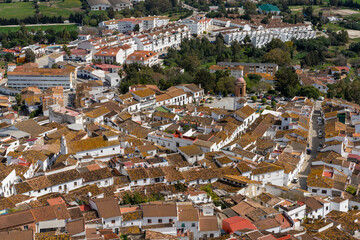 Sticker - whitewashed village of Jimena de la Frontera high angle view with rooftops and church