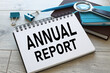 © Svetlana - Annual report stationery.text on open notepad