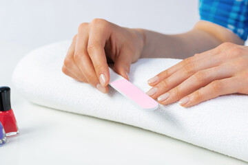 Wall Mural - Woman using nail file and create nails shape