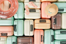 Pattern Of Many Suitcases Stacked With Summer Travel Accessories