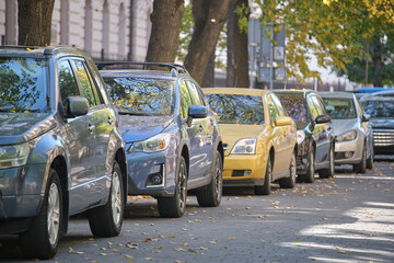 Sticker - City traffic with many cars parked in line on street side