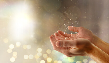 Wall Mural - Praying religious hands concept with glitters and lights background