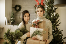 Portrait Happy Teenage Girl Friends With Christmas Gifts