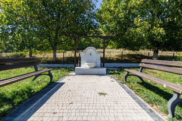 Two benches and a drinking water fountain