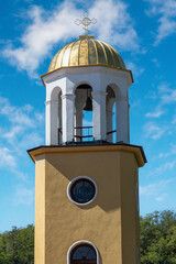 Bell tower of a church with golden dome