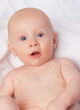 © Tabitha R/peopleimages.com - Hes his moms little angel. Cropped shot of an adorable baby boy in a studio.