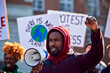 © Monkey Business - Group Of Protestors With Placards On Demonstration March Against Climate Chane