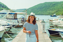 Woman In White Fashion Luxury View Walking By Dock Boats On Background