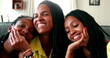 © Marco - Happy African mother posing with teenage daughters together smiling
