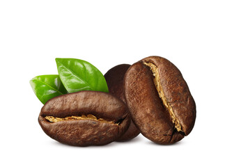 Aromatic roasted coffee beans and fresh green leaves on white background