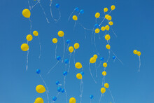 Blue And Yellow Balloons In The Blue Sky