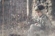 © Jacek - Child and war. Little, poor boy in the ruins of a bombed house.