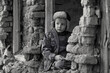 © Jacek - Child and war. Little, poor boy in the ruins of a bombed house.