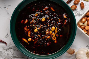 Wall Mural - Chili oil sauce with sesame and peanuts called macha. Mexican food