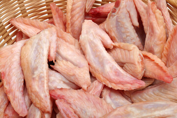 Poster - Raw chicken wings on White background