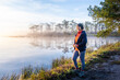 © chirawan_nt - Senior Woman standing on Wang Kwang Reservoir Phu Kradueng National Park, Loei province, Thailand