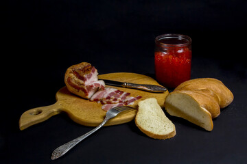 Still life with bread, lard and red caviar