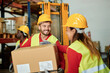 © Gabriel Trujillo - Smiling warehouse worker with clipboard