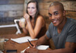 © Mikolette M/peopleimages.com - Study buddies. Portrait of two young friends studying together at a coffee shop.
