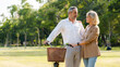 © Rapeepat - Senior Caucasian couple hugging in park. Family with a happy smile feels relaxed with nature in the morning. Or in the evening. Enter elderly society And retire from work. Concept health insurance