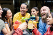 © Xavier Lorenzo - Millennial people having fun while social gathering together at weekend party - Happy young multiethnic friends drinking cocktails at bar terrace - Friendship and celebrate concept