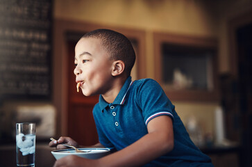 Poster - Im happiest when mom makes her famous spaghetti. Cropped shot of a young boy eating a bowl of spaghetti at home.