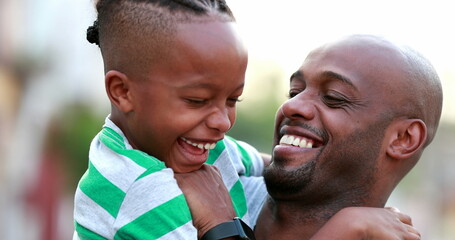 Wall Mural - Father tickling child son. African black ethnicity parent and kid bonding together laughing and smiling