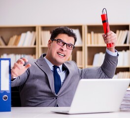 Wall Mural - Businessman with dynamite in the office