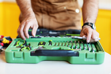 The wizard puts a set of tools in a box