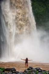 Poster - Beautiful woman near a waterfall in Bali