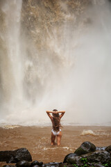 Sticker - Beautiful woman near a waterfall in Bali