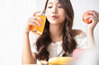 © Shutter B - Healthy lifestyle, Close up beautiful young asian woman with fruit juice smiling happy. Healthy eating, Food and lifestyle, Health, Beauty, Dieting concept.