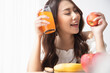 © Shutter B - Healthy lifestyle, Close up beautiful young asian woman with fruit juice smiling happy. Healthy eating, Food and lifestyle, Health, Beauty, Dieting concept.