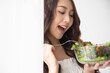 © Shutter B - Healthy lifestyle, Close up beautiful young asian woman eating salad smiling happy. Healthy eating, Food and lifestyle, Health, Beauty, Dieting concept.