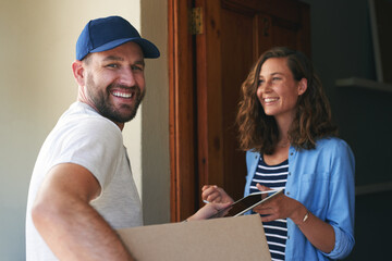 Wall Mural - Another delivery handed over to a satisfied customer. Portrait of a courier making a delivery to a customer at her home.