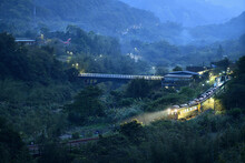 A Local Train Running At A Beautiful Country Station At Dusk In Pingxi, New Taipei City, Taiwan