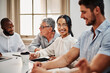 © Mikolette M/peopleimages.com - If you want it, well design it. Shot of a young businesswoman using a digital tablet during a meeting in a modern office.