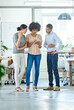 © Yuri A/peopleimages.com - Three great minds think alike. Shot of a group of office colleagues having a discussion over a digital tablet.
