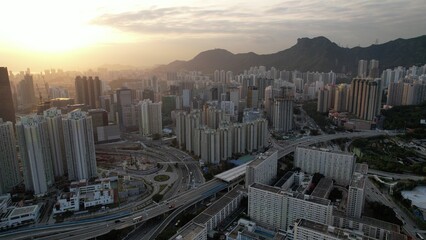 Wall Mural - Kowloon cityscape with sunset, with lion rock