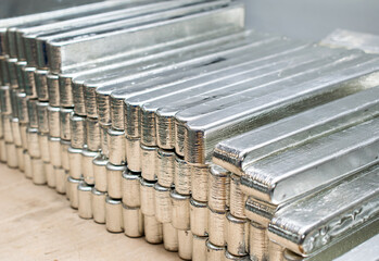 a stack of silver metal bars. tin