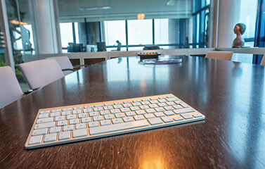 Modern wireless keyboard on a modern office table. Business concept.