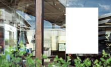 Mockup White Paper Or White Sticker Poster Displayed On The Front Of The Restaurant, Coffee Shop, Promotion Information For Marketing Announcements And Details