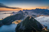 Rio de Janeiro cityscape with famous Sugarloaf Cable Car at sunset in Rio de Janeiro, Brazil.